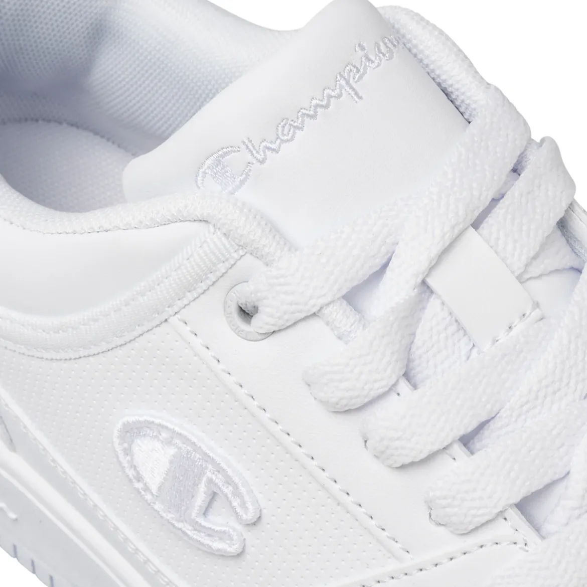 Sneakers bianche da uomo con logo laterale Champion Rebound Low